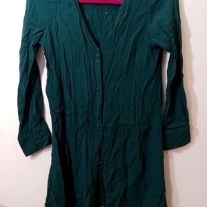 Deep green long button down chiffon shirt .